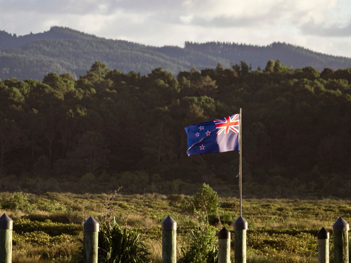 New Zealand border checkpoint with staff and vehicles