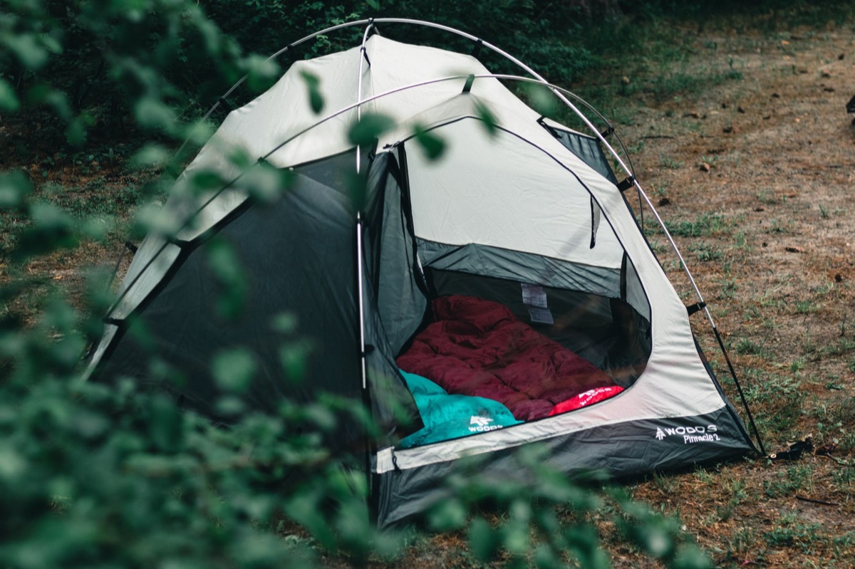 camping van interior with sleeping bag and camping gear