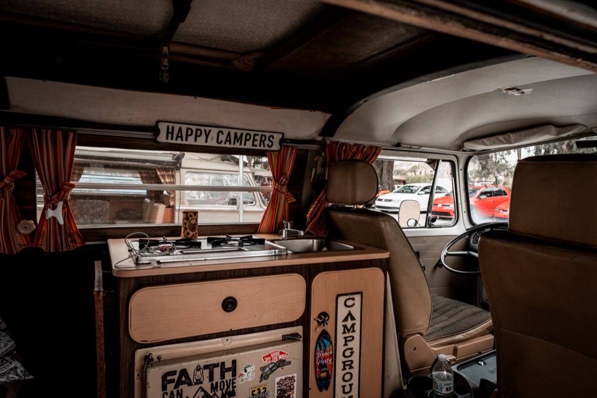 camping van with camping equipment and recreational van with lounge furniture