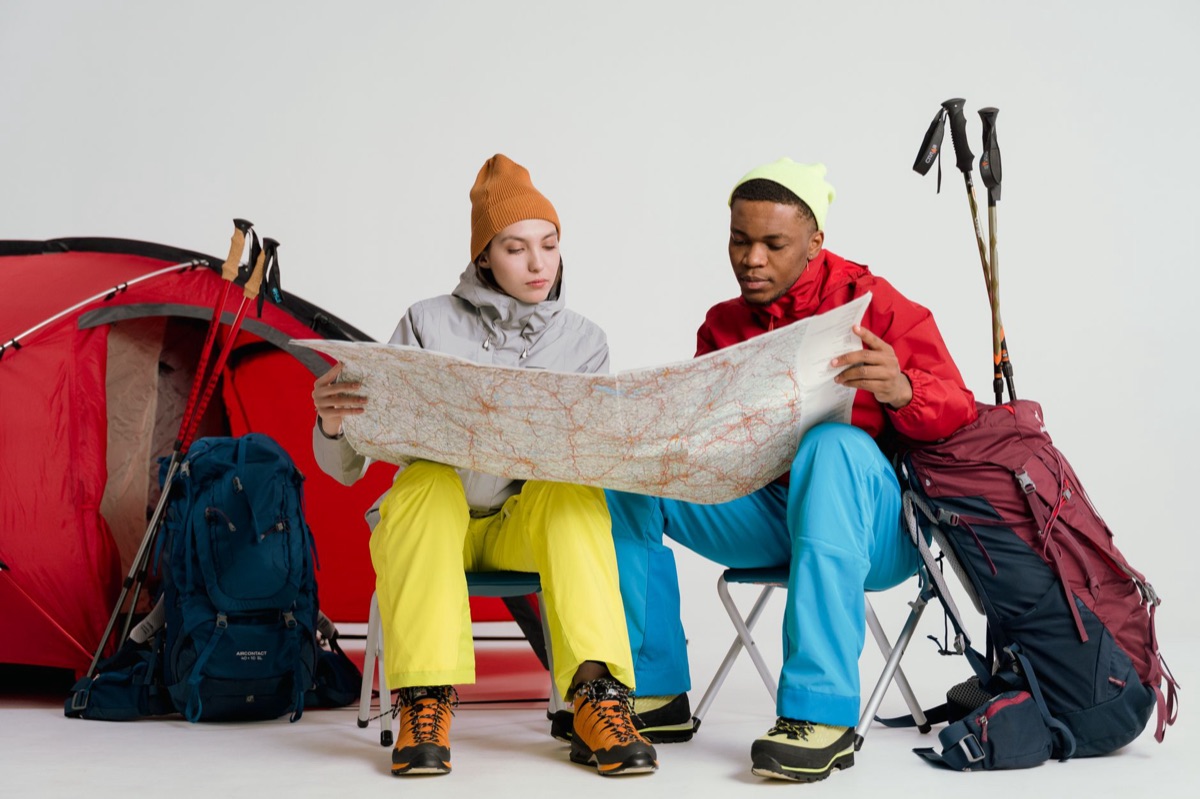 north island camping trail with map and backpack