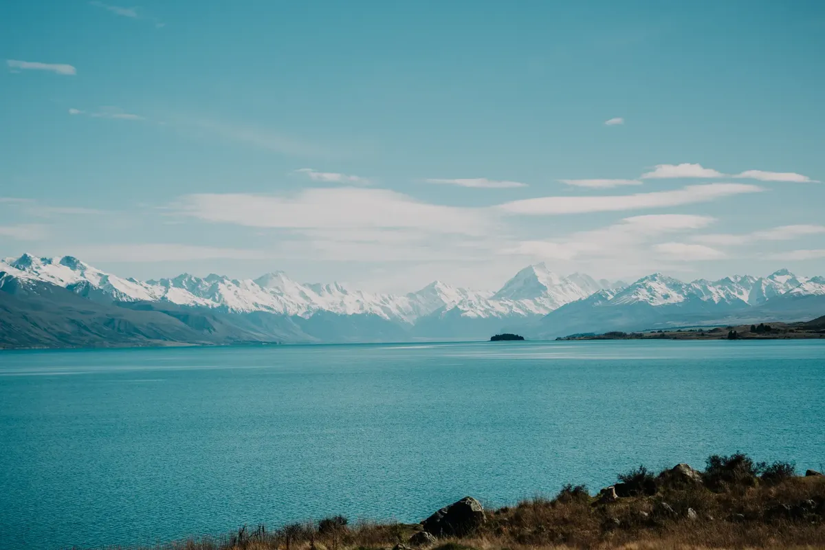 Stunning view of Lake Tekapo with snow-capped Southern Alps, New Zealand.
